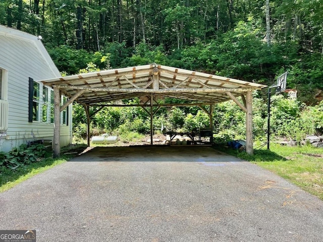 906 Billy Watts Cove Rd, Tiger, GA 30576 - view of parking / parking lot with asphalt driveway, a detached carport, and a forest view