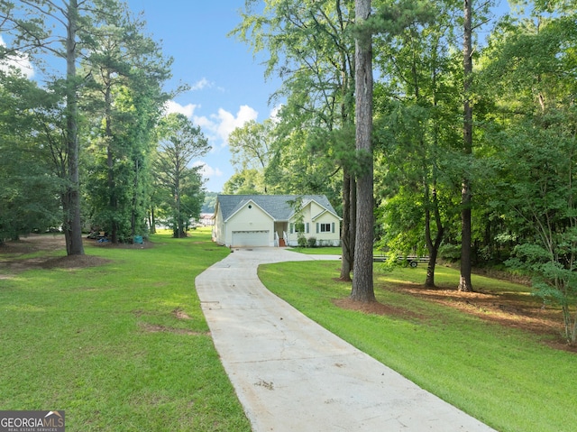 901 Jamesway Dr, Sparta, GA 31087 - view of front of property with concrete driveway, a front yard, and a garage