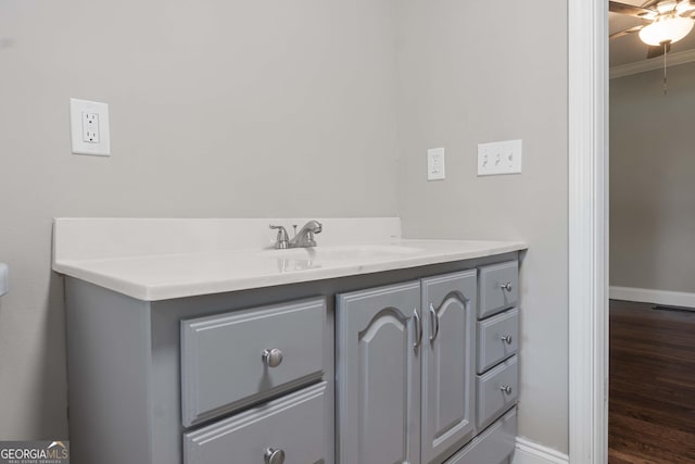 901 Jamesway Dr, Sparta, GA 31087 - bathroom with vanity, wood finished floors, crown molding, and ceiling fan