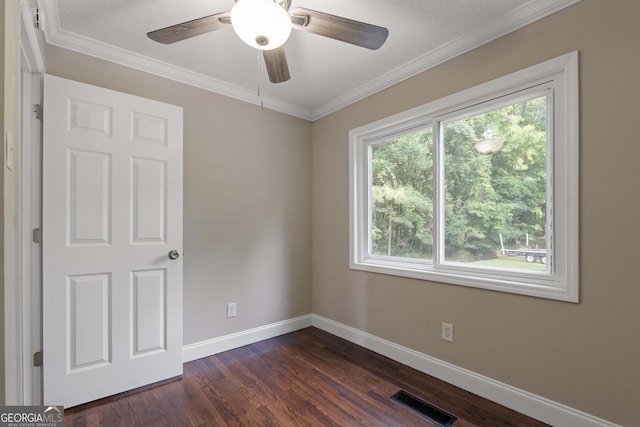 901 Jamesway Dr, Sparta, GA 31087 - unfurnished room with dark wood finished floors, crown molding, and a ceiling fan