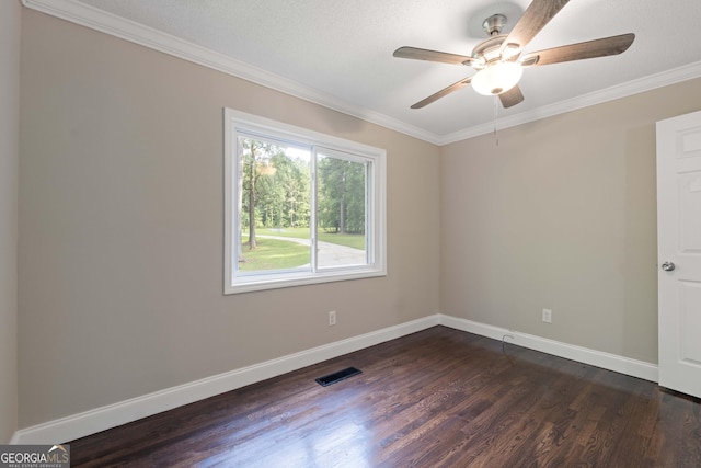901 Jamesway Dr, Sparta, GA 31087 - spare room with dark wood-style flooring, a ceiling fan, and crown molding