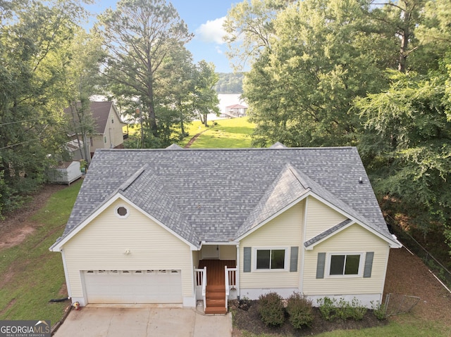 901 Jamesway Dr, Sparta, GA 31087 - view of front of house with roof with shingles, an attached garage, concrete driveway, and a front yard