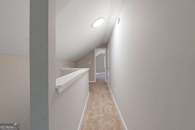 901 Jamesway Dr, Sparta, GA 31087 - corridor featuring vaulted ceiling, light carpet, and an upstairs landing