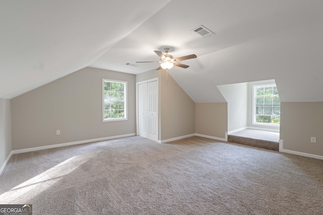 901 Jamesway Dr, Sparta, GA 31087 - additional living space with carpet floors, ceiling fan, healthy amount of natural light, and vaulted ceiling