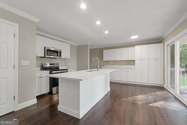 901 Jamesway Dr, Sparta, GA 31087 - kitchen with stainless steel appliances, crown molding, dark wood-style floors, light countertops, and white cabinetry