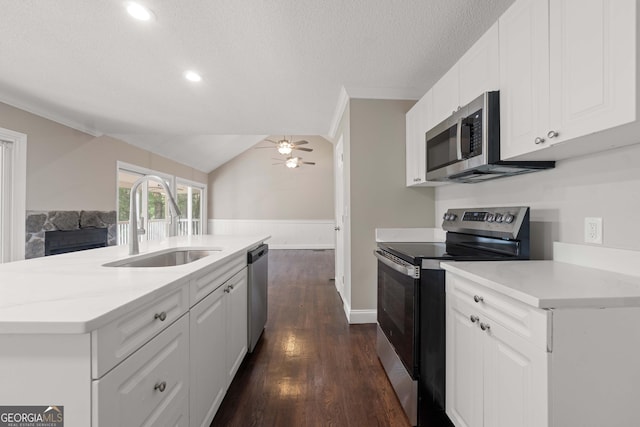 901 Jamesway Dr, Sparta, GA 31087 - kitchen featuring appliances with stainless steel finishes, ceiling fan, white cabinets, dark wood-type flooring, and a textured ceiling