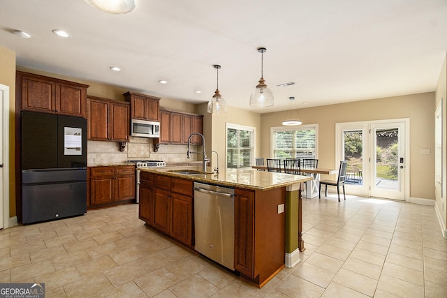 10 Ridgeview Ct, Newnan, GA 30263 - kitchen featuring stainless steel appliances, decorative backsplash, light stone counters, pendant lighting, and recessed lighting