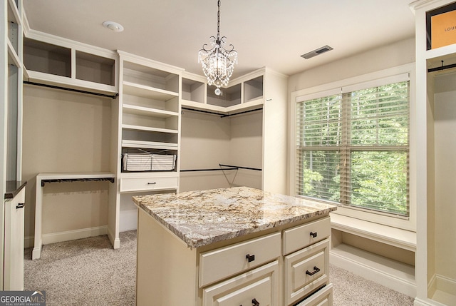 10 Ridgeview Ct, Newnan, GA 30263 - walk in closet featuring a chandelier and light carpet