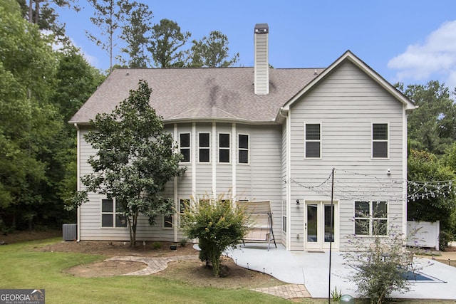 10 Ridgeview Ct, Newnan, GA 30263 - back of property featuring a patio area, a yard, a chimney, and a shingled roof