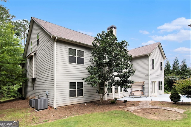 10 Ridgeview Ct, Newnan, GA 30263 - rear view of property with a chimney, a patio area, roof with shingles, and a lawn