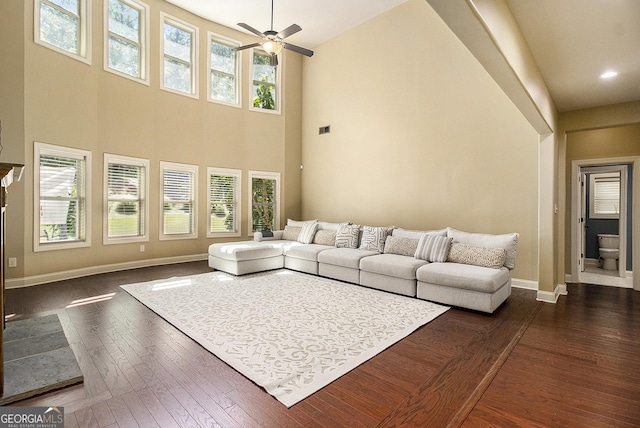 10 Ridgeview Ct, Newnan, GA 30263 - living area featuring ceiling fan, a towering ceiling, and dark wood finished floors