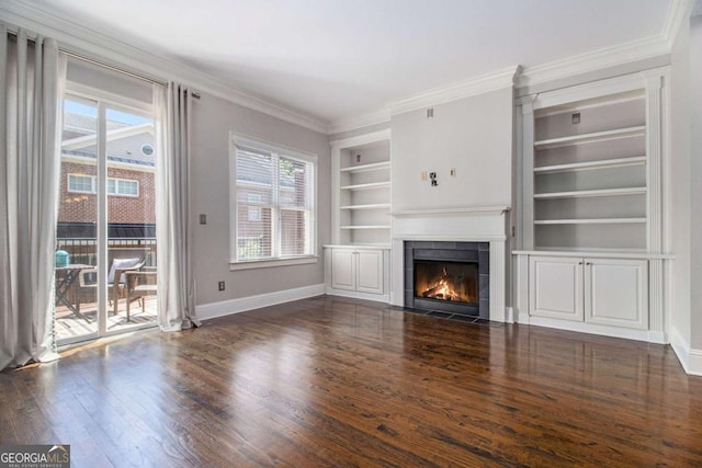 1836 Preserve Way, Brookhaven, GA 30341 - unfurnished living room featuring built in shelves, dark wood-style floors, a fireplace, and ornamental molding