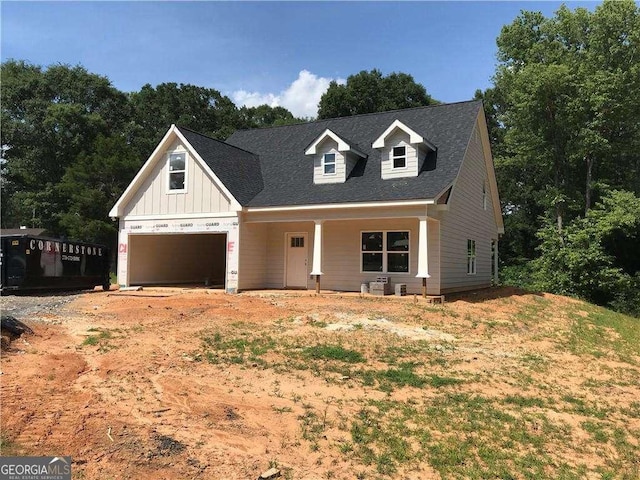104 Hunter Dr NE, Calhoun, GA 30701 - view of front of home with board and batten siding, covered porch, and an attached garage