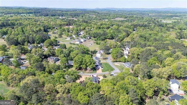 104 Hunter Dr NE, Calhoun, GA 30701 - aerial overview of property's location with a heavily wooded area