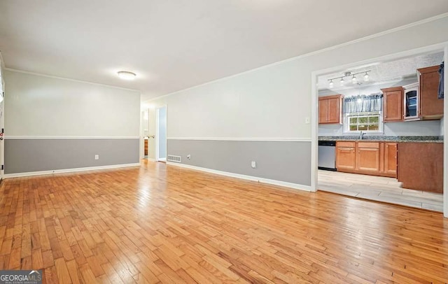 4212 Worth St NW, Acworth, GA 30101 - unfurnished living room featuring light wood-type flooring, crown molding, and rail lighting