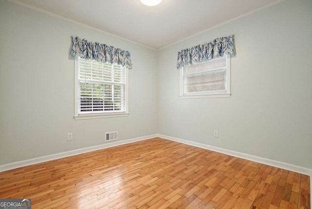 4212 Worth St NW, Acworth, GA 30101 - spare room featuring light wood-style floors and ornamental molding