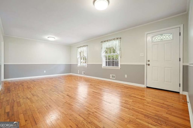 4212 Worth St NW, Acworth, GA 30101 - entrance foyer featuring light wood-style flooring and ornamental molding