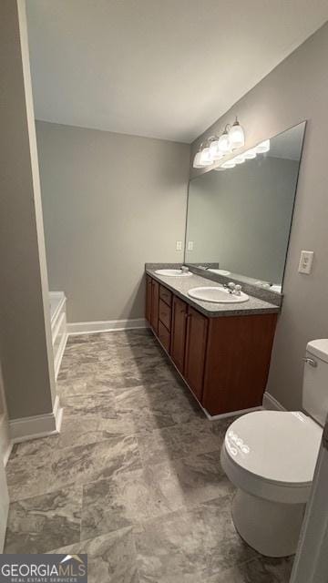 320 Cainbridge Mdws, Demorest, GA 30535 - bathroom featuring toilet and double vanity