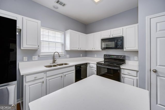 5381 Briar Creek Ln, Norcross, GA 30071 - kitchen with black appliances, white cabinets, and light countertops