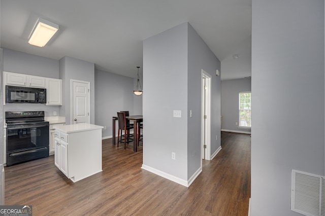 5381 Briar Creek Ln, Norcross, GA 30071 - kitchen with black appliances, white cabinets, dark wood finished floors, and light countertops