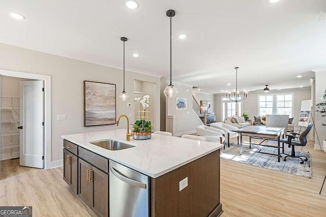 164 Palm St, Holly Springs, GA 30188 - kitchen with dishwasher, light wood-style flooring, open floor plan, dark brown cabinetry, and ornamental molding