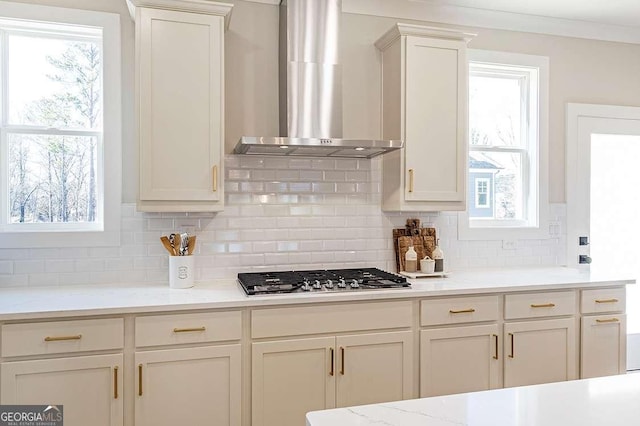 164 Palm St, Holly Springs, GA 30188 - kitchen featuring wall chimney range hood, stainless steel gas stovetop, tasteful backsplash, and healthy amount of natural light