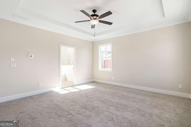 164 Palm St, Holly Springs, GA 30188 - unfurnished room featuring a raised ceiling, a ceiling fan, and light carpet