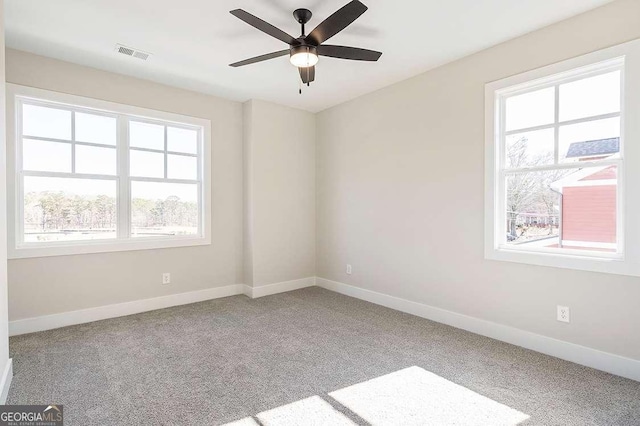 164 Palm St, Holly Springs, GA 30188 - unfurnished room with healthy amount of natural light, carpet flooring, and ceiling fan