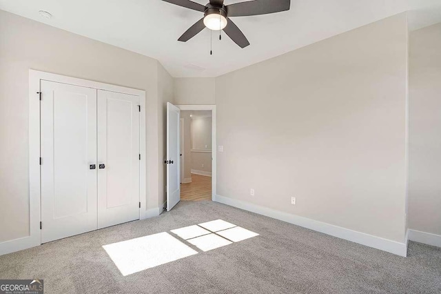 164 Palm St, Holly Springs, GA 30188 - unfurnished bedroom featuring carpet floors, a closet, and a ceiling fan