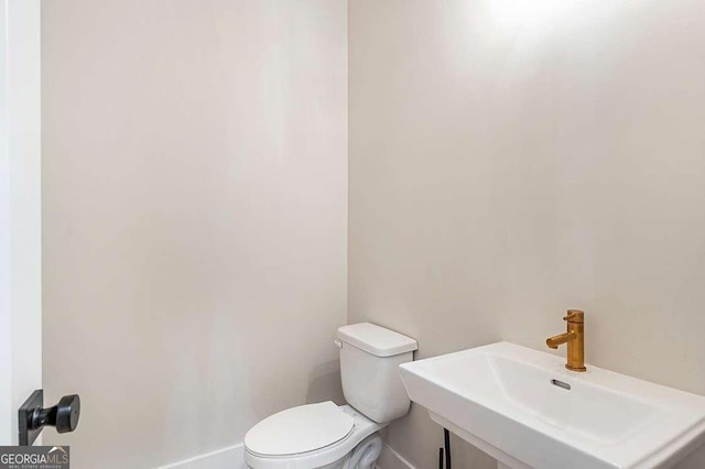 164 Palm St, Holly Springs, GA 30188 - half bathroom with a sink and toilet