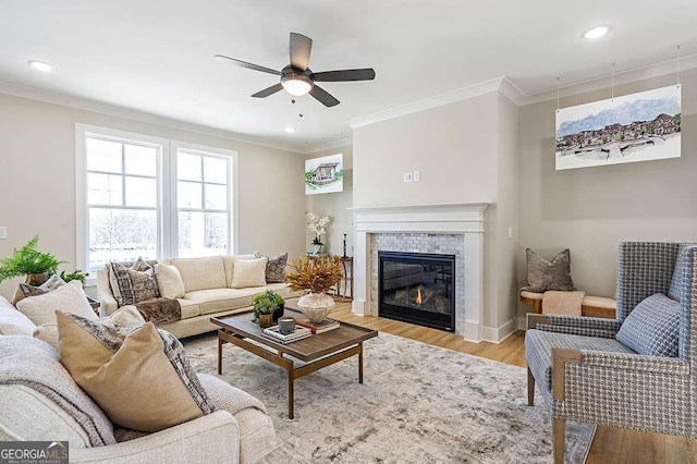 164 Palm St, Holly Springs, GA 30188 - living area featuring ceiling fan, ornamental molding, light wood finished floors, a tile fireplace, and recessed lighting