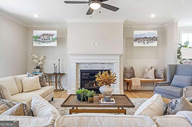 164 Palm St, Holly Springs, GA 30188 - living room with ornamental molding, light wood-style floors, ceiling fan, recessed lighting, and a brick fireplace