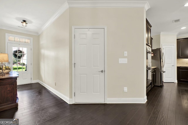 5640 Hammock Way, Cumming, GA 30028 - foyer with dark wood-style flooring and ornamental molding