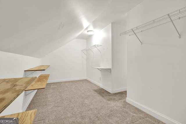 5640 Hammock Way, Cumming, GA 30028 - spacious closet with carpet flooring and vaulted ceiling
