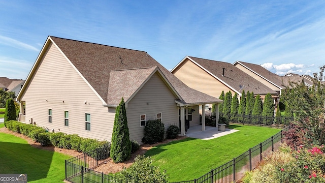 5640 Hammock Way, Cumming, GA 30028 - back of house featuring a patio, roof with shingles, and a fenced backyard