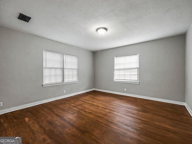 805 First Ave, Brunswick, GA 31520 - spare room with dark wood finished floors and baseboards