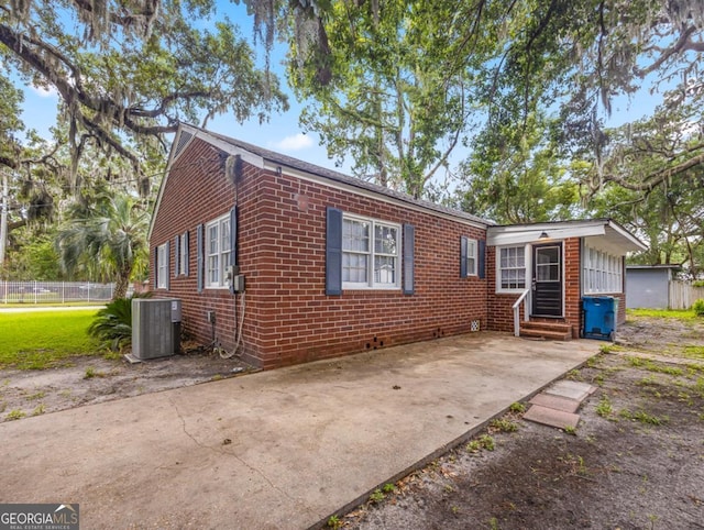 805 First Ave, Brunswick, GA 31520 - view of front of property with entry steps, brick siding, and a patio area