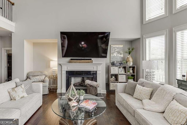 1830 Secretariat Gait Way, Suwanee, GA 30024 - living area featuring a high ceiling, dark wood finished floors, and a fireplace