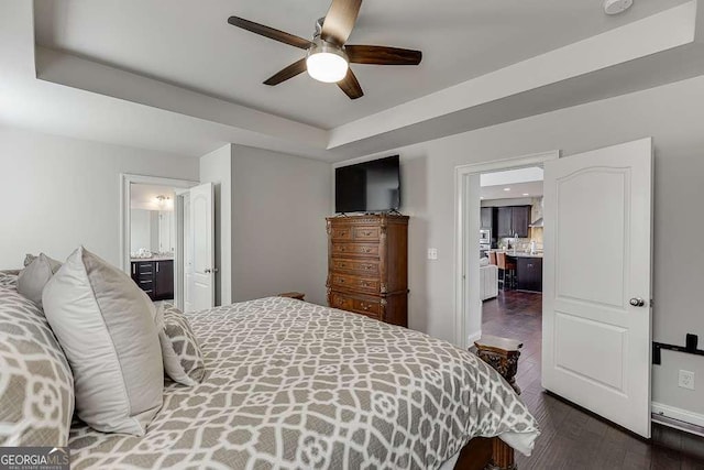 1830 Secretariat Gait Way, Suwanee, GA 30024 - bedroom featuring dark wood-style floors, ensuite bath, a raised ceiling, and ceiling fan