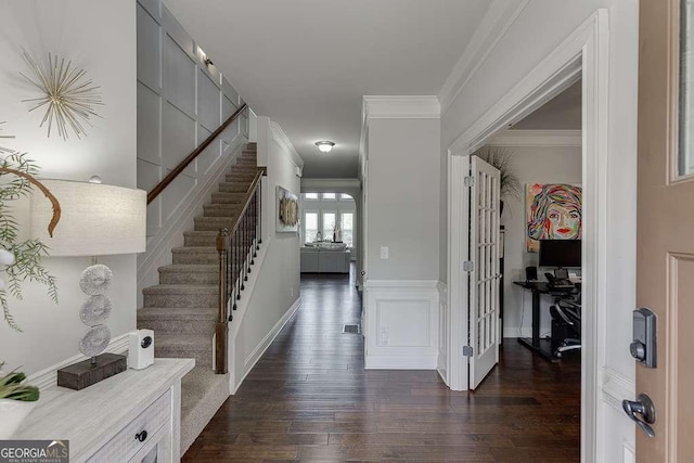 1830 Secretariat Gait Way, Suwanee, GA 30024 - foyer with dark wood-style floors, crown molding, and stairway