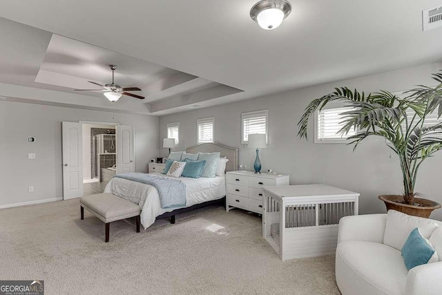 1830 Secretariat Gait Way, Suwanee, GA 30024 - bedroom featuring a raised ceiling, light carpet, ceiling fan, and connected bathroom