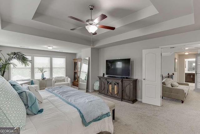 1830 Secretariat Gait Way, Suwanee, GA 30024 - bedroom with a tray ceiling, light carpet, and ceiling fan