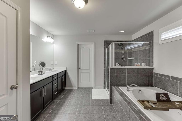 1830 Secretariat Gait Way, Suwanee, GA 30024 - bathroom featuring a bath, double vanity, a stall shower, and tile patterned floors