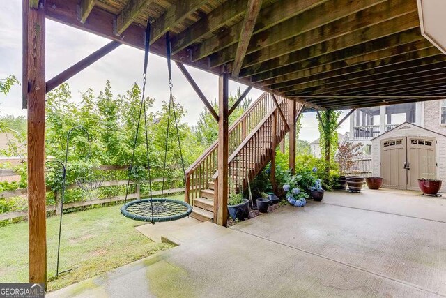 1830 Secretariat Gait Way, Suwanee, GA 30024 - view of patio featuring stairs and a storage unit