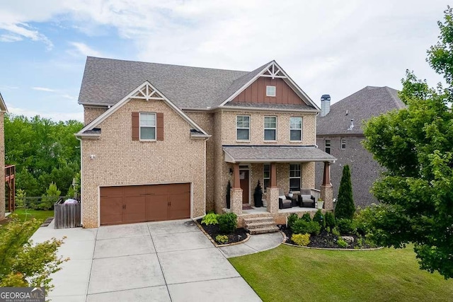 1830 Secretariat Gait Way, Suwanee, GA 30024 - craftsman-style house featuring brick siding, covered porch, a front yard, and driveway