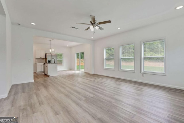307 E Pine St E, Rockmart, GA 30153 - unfurnished living room with light wood-style floors, ceiling fan, and recessed lighting