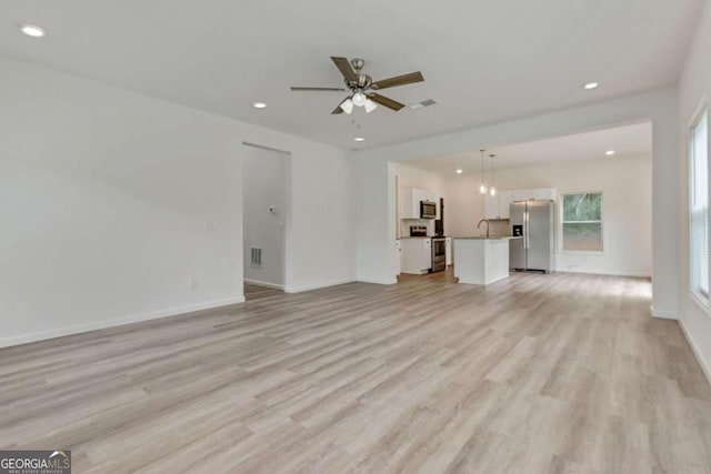 307 E Pine St E, Rockmart, GA 30153 - unfurnished living room with recessed lighting, light wood-style floors, and a ceiling fan