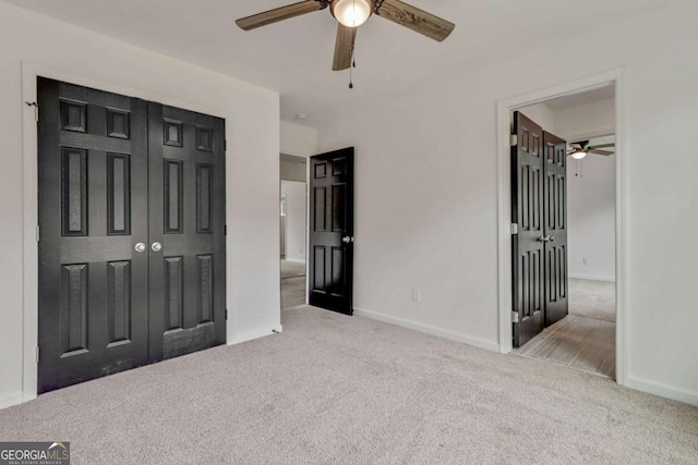 307 E Pine St E, Rockmart, GA 30153 - unfurnished bedroom featuring carpet floors, a closet, and a ceiling fan