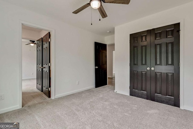 307 E Pine St E, Rockmart, GA 30153 - unfurnished bedroom featuring carpet, a closet, and a ceiling fan