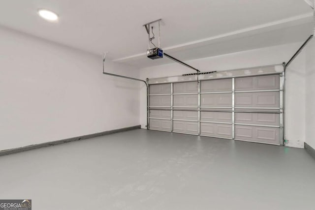 307 E Pine St E, Rockmart, GA 30153 - garage featuring a garage door opener and baseboards